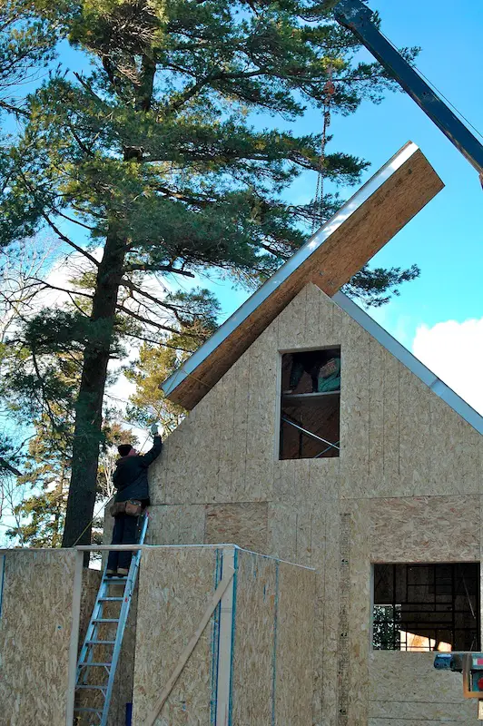 SIP construction of this lakeside cabin includes roof panels instead of rafters or trusses. The result is an open and completely useable attic loft.