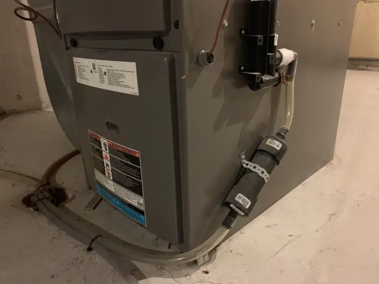 Basement furnace with attached tubing and labels