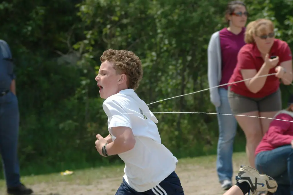 boy winning running race at finish line