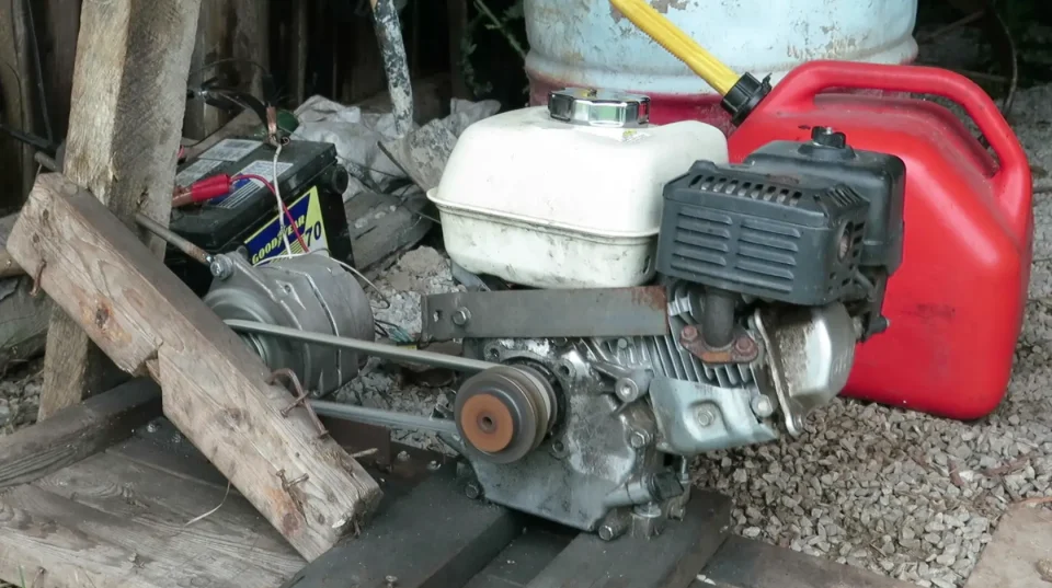 Homemade DIY generator setup with engine and battery.
