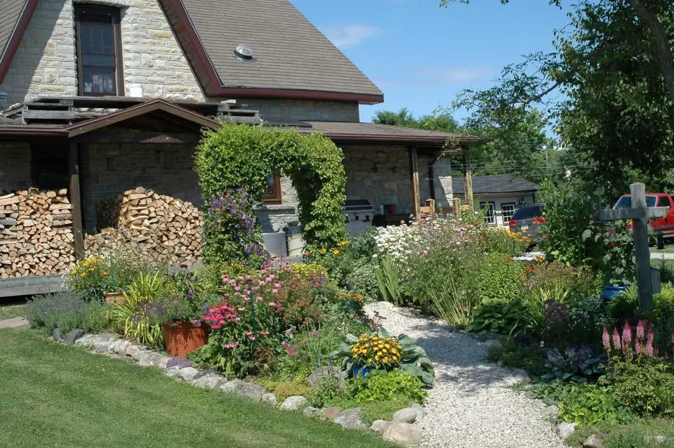 Beautiful garden beside rustic stone house