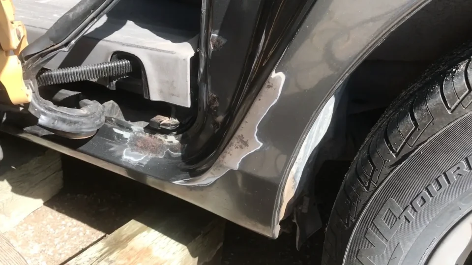 Close-up of car wheel and body detailing