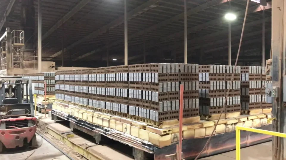 Stacks of bricks inside a warehouse.
