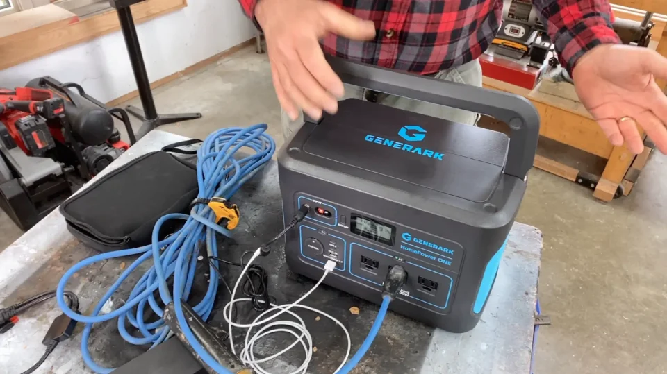 Portable generator kit with cables in workshop