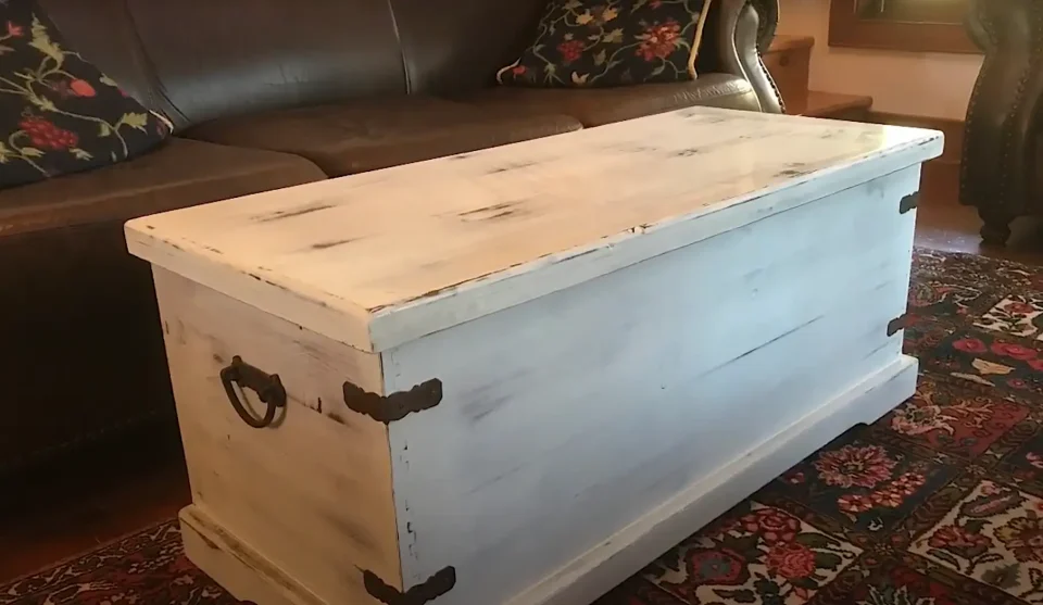 Rustic white storage chest on patterned rug