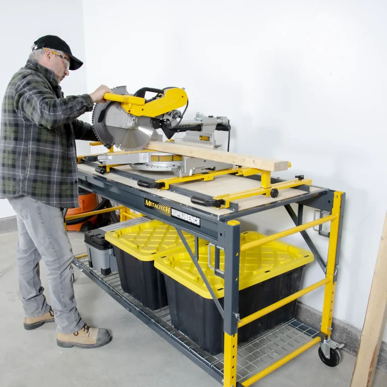 Person using miter saw on yellow workbench.