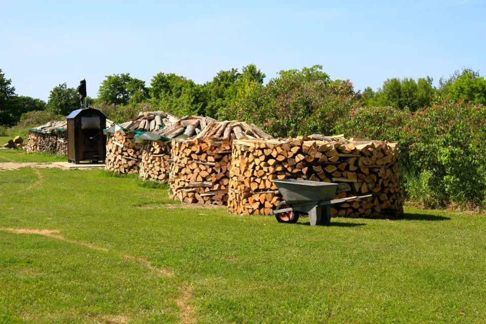 Here are some of the round wood piles we build at our place. Much faster stacking, greater resistance to falling over,  and interesting appearance are the advantages.