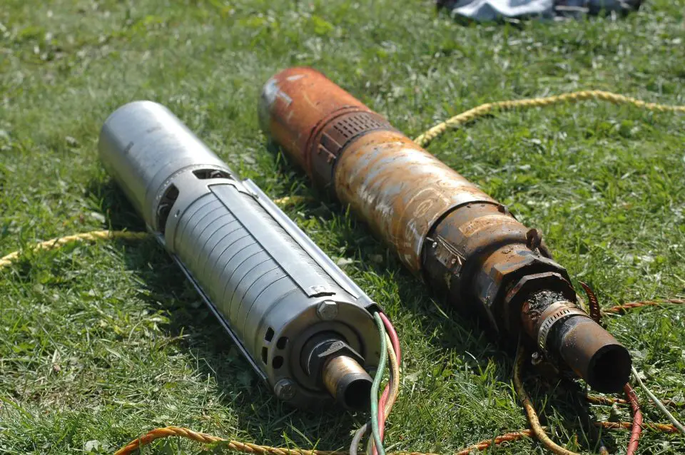 Two underground water pumps on grass