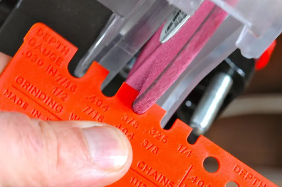 This orange plastic gauge lets you check and see that the grinding wheel has the correct semi-circular shape. Wheels need to be reshaped after a period of use with a wheel dressing tool.