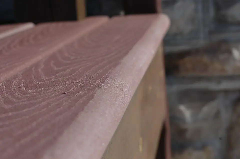 This bullnose profile is on the edge of TREX composite deck lumber. This material is 1 1/2″ thick, and the semi-circular profile was produced with two passes from a 3/4″ radius roundover router bit.