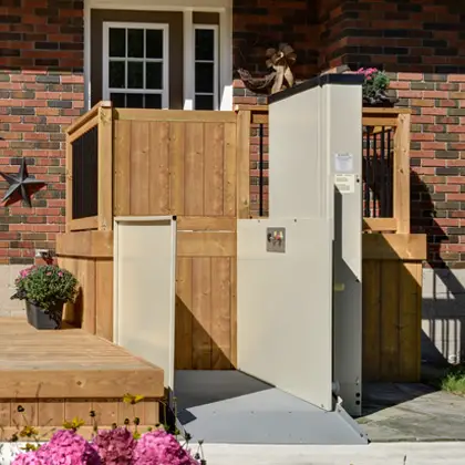 This is a typical porch lift, installed and ready to use. Lifts like this take up much less space than a ramp, and they work well in all weather.