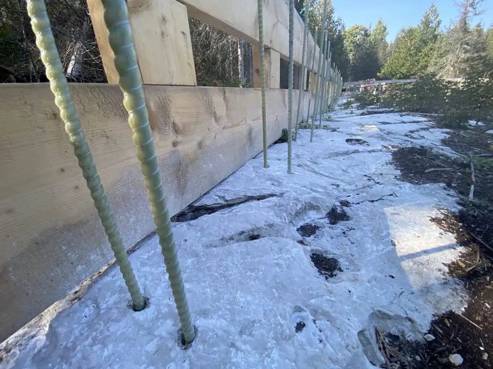 Here you can see pairs of fiberglass rebar inserted into holes in bedrock, ready for anchoring with epoxy.