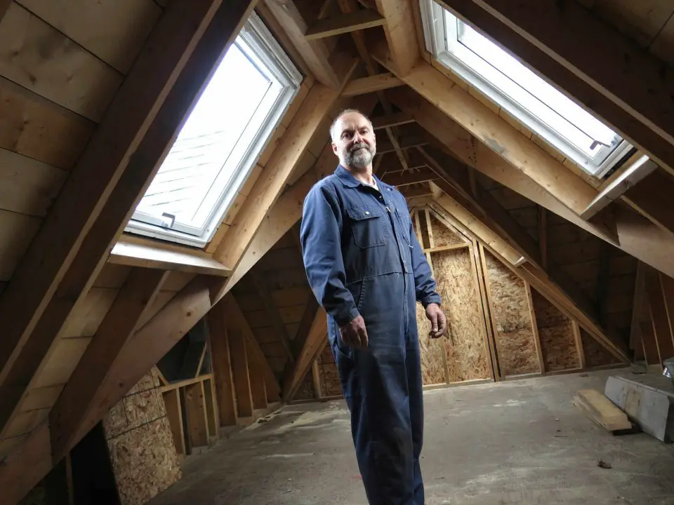 This is me standing in the loft of the house my son and I built together for him and his family. This space is a sleeping loft in the finished home, seen below.