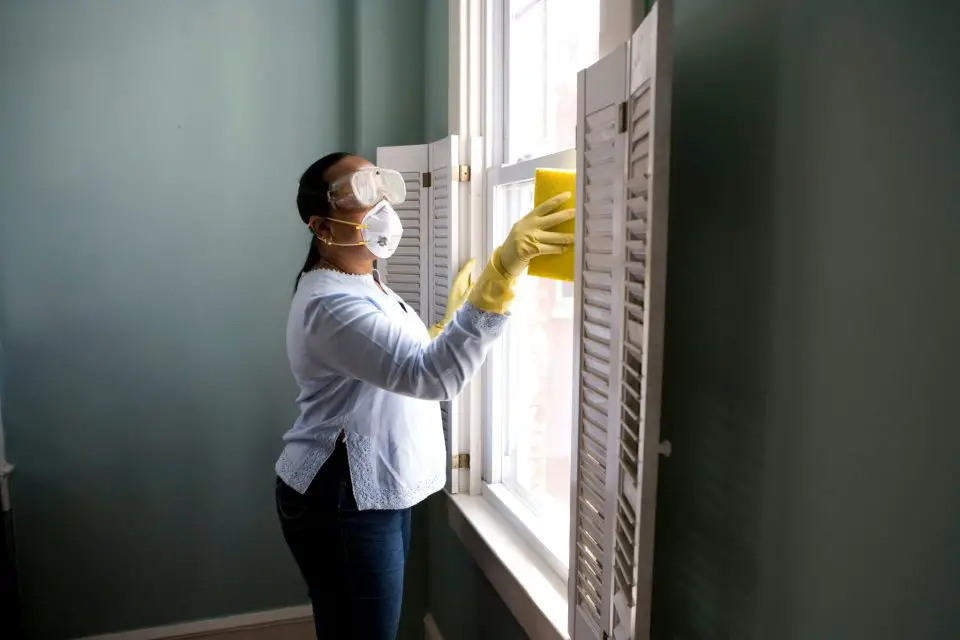 woman cleaning windows