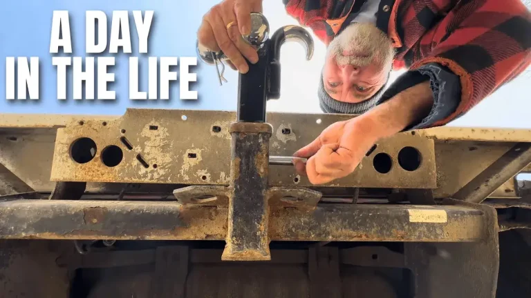 Man repairing metal frame, day in life scene.