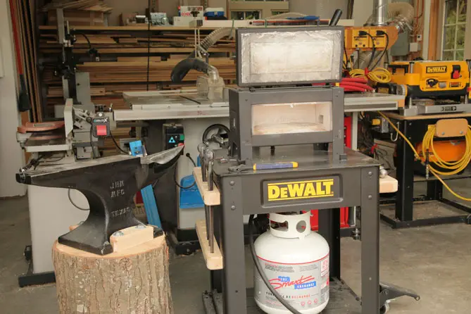 Don’t be fooled by the DEWALT logo. That’s just a rolling steel stand made by DEWALT that I used to support my forge. The forge itself is the open box on top.