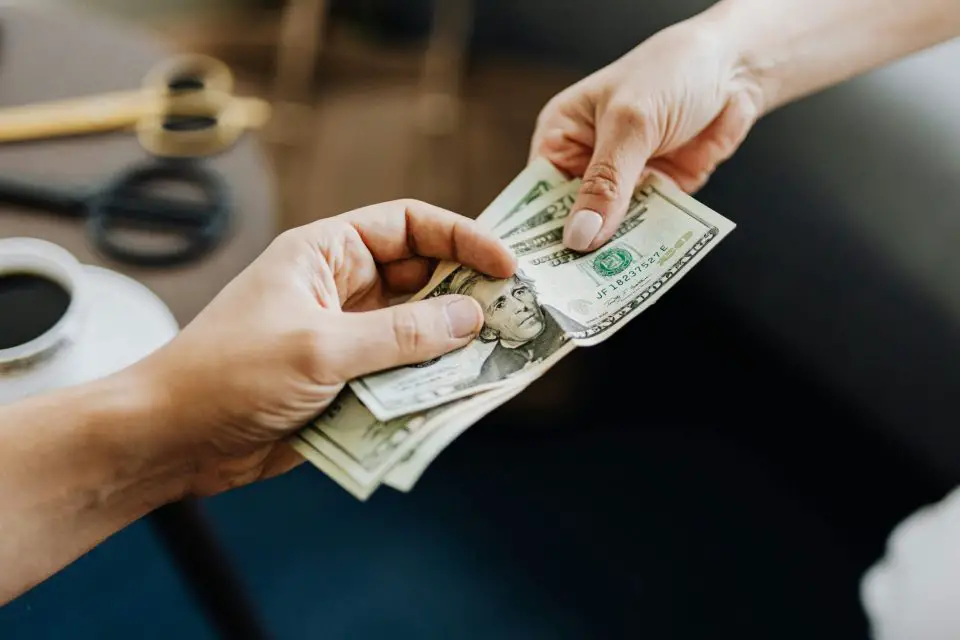 people exchanging cash money