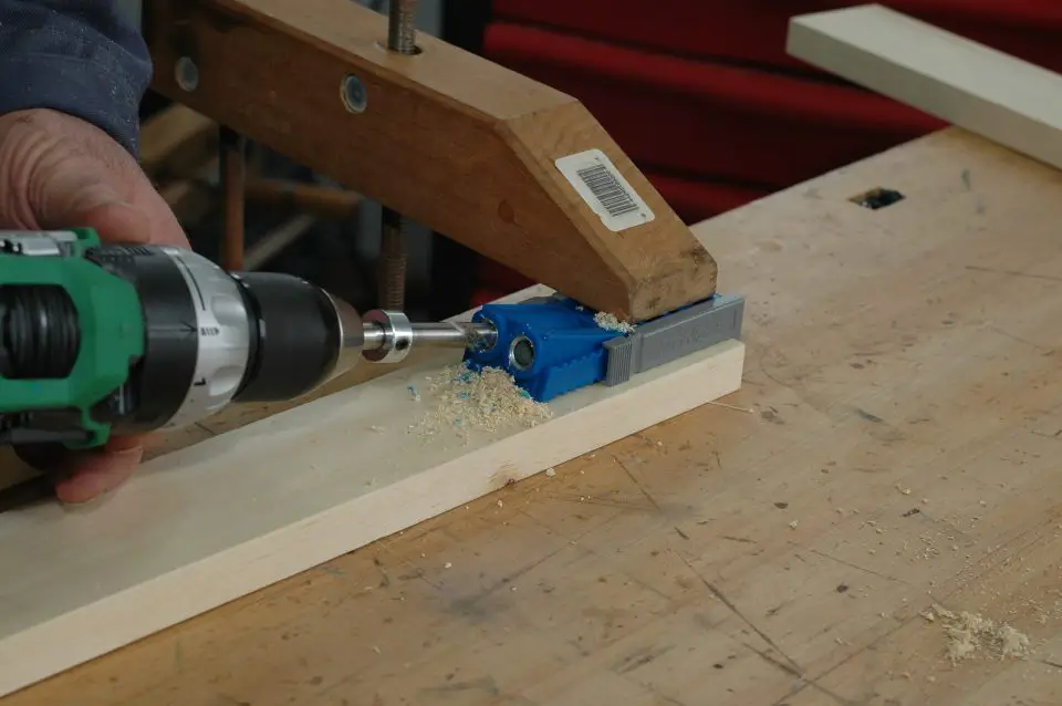 A simple pocket hole jig being used to guide drilling of a pocket screw hole. It doesn’t take much money to get into the pocket joinery game.