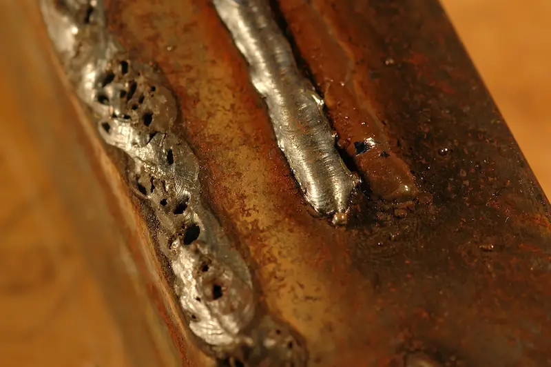 The cleaner weld on the right was made with a gas-shielded MIG process. The rough weld on the left made with self-shielding welding wire (also called flux-core wire) and no gas.