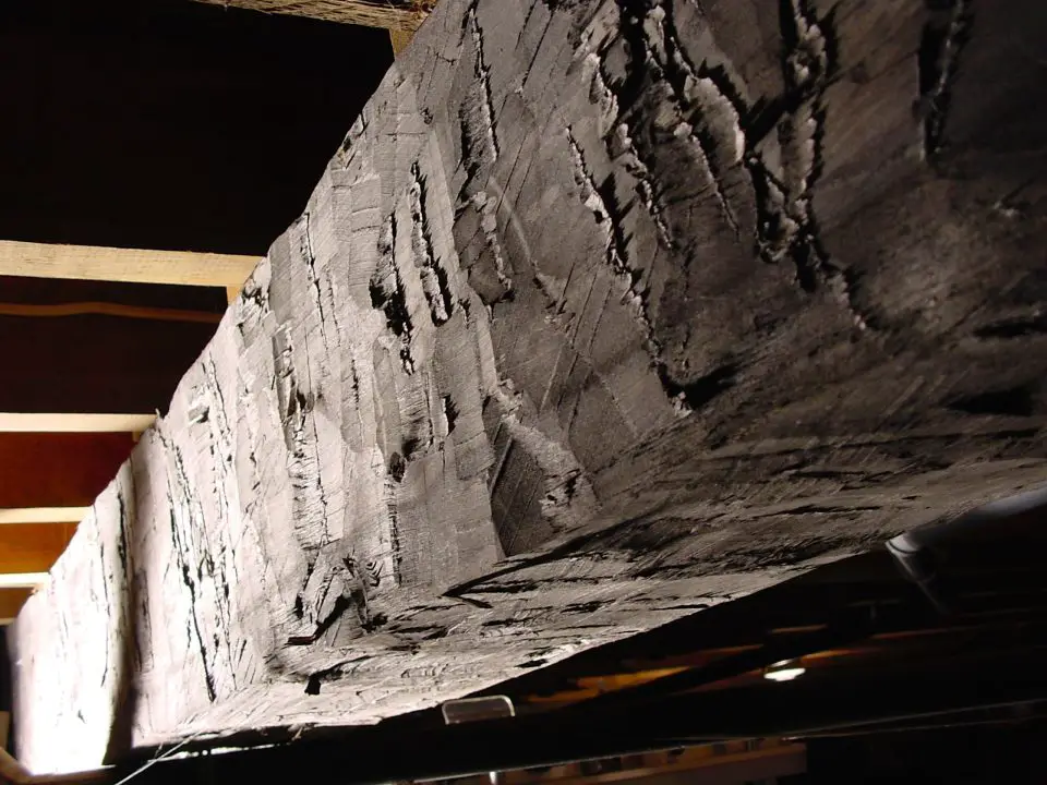 It’s surprisingly easy to hew a straight, accurate beam like this one from a log. I made three beams like this in a day and they’re holding up the main floor of my house.