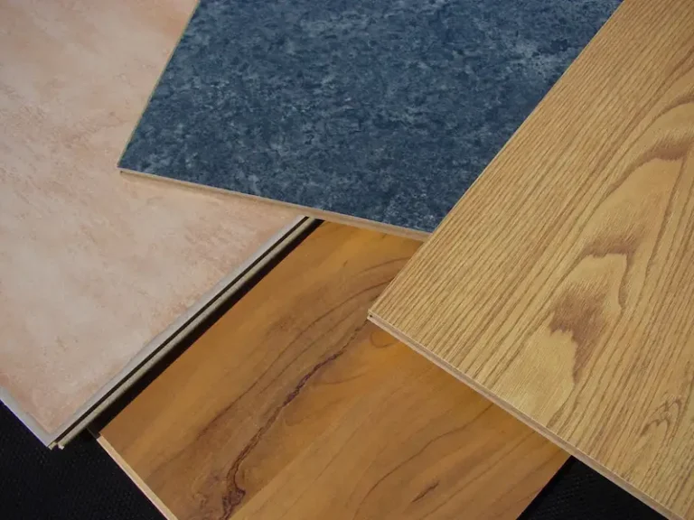 Various wood laminate flooring samples on display.