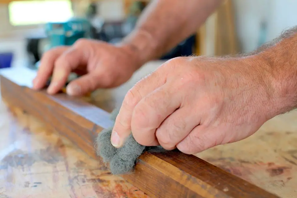 Rubbing down a final coat of finish on some ash stair spindles I made for a project. Abrasives like this come in very fine grades.