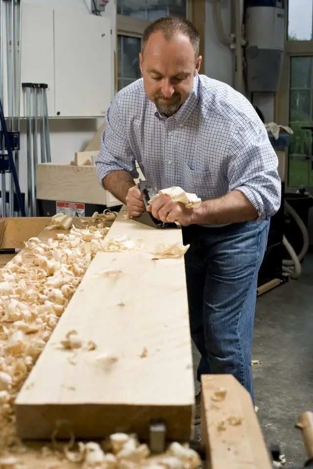 Here I am planing the face of a piece of rough 2×8 pine. Few people realize that hand planes can replace thickness planers for small jobs like this one.