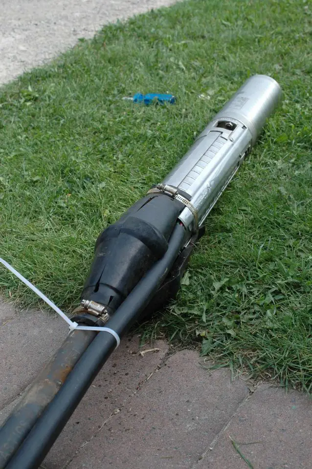 This is a submersible pump, ready to go down into a well. Submersibles like this one are essential for building the trickle system that gets lots of water from a weak well.