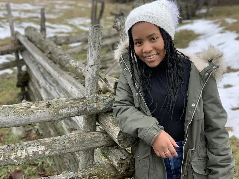 This is our youngest, Ellie, standing next to one of the rail fences she’s grown up with.