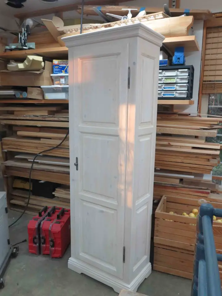 This cabinet is now in our bathroom and was finished with a white pickling stain. The hallmark of pickling is a combination of colour added while wood grain continues to show through.