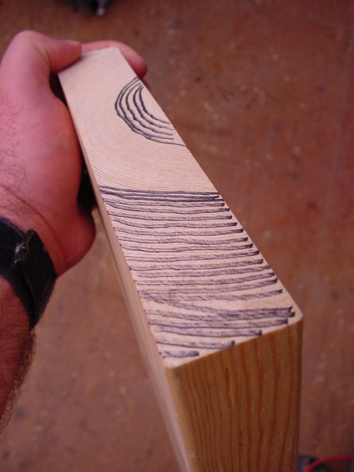 I used a black marker to highlight growth ring orientation. The section of the board in the foreground has a more vertical grain direction and is more stable than the middle of this board.