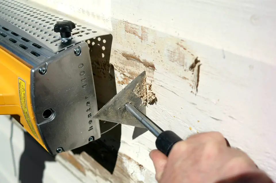 The Silent Strip Paint Remover infrared heat gun in use at my place. It softens paint at low enough temperature that lead is not vapourized into a harmful gas.