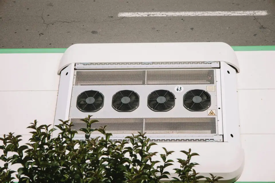 Four rooftop fans on large vehicle, overhead view.