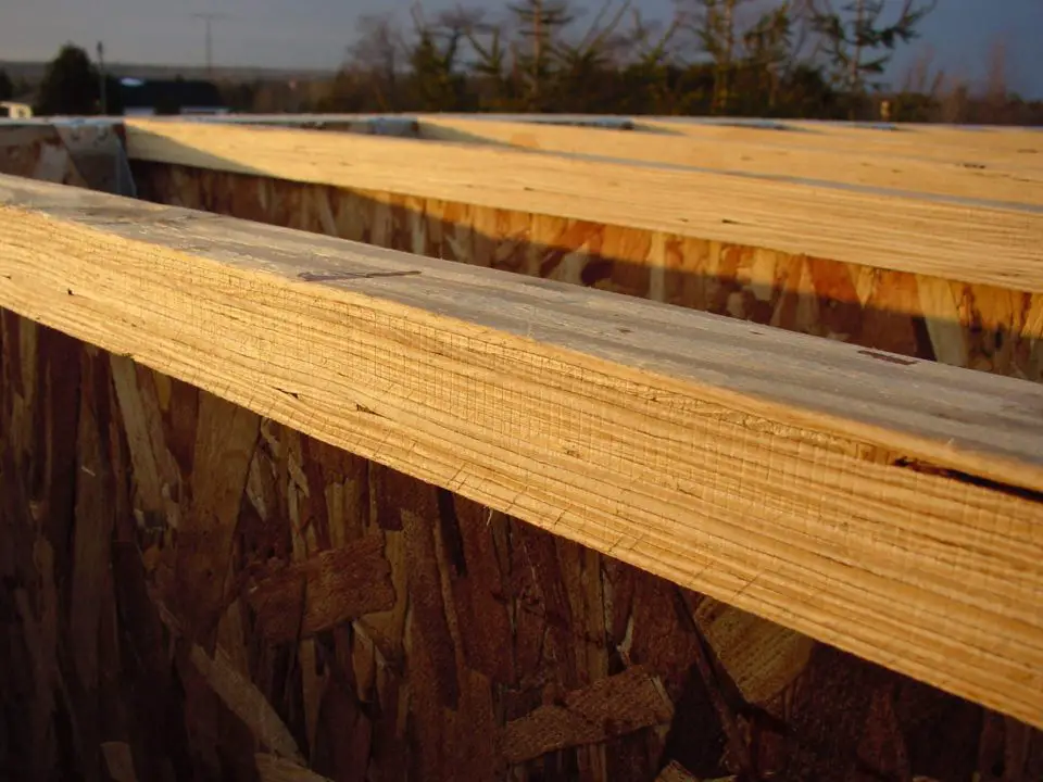The top chord of an engineered floor joist. The top and bottom edges have the most wood because this is where most of the stresses of bearing a load are concentrated.