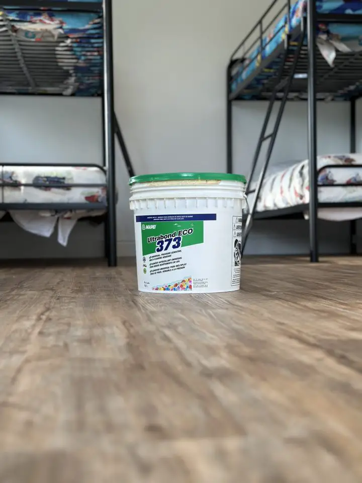 This was the adhesive used to secure each piece of flooring. It’s strong enough to hold things firm, yet soft enough to allow individual flooring pieces to be lifted and replaced if needed.