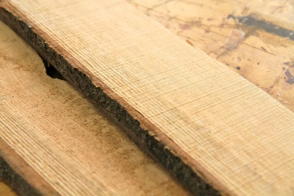 These little oak boards were cut from the log using a bandsaw. The bark can be left on for effect, or cut off.