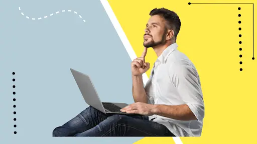 Man pondering while using laptop on colourful background.