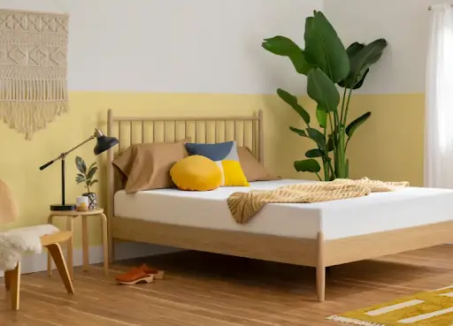 Modern bedroom with yellow accents and plants