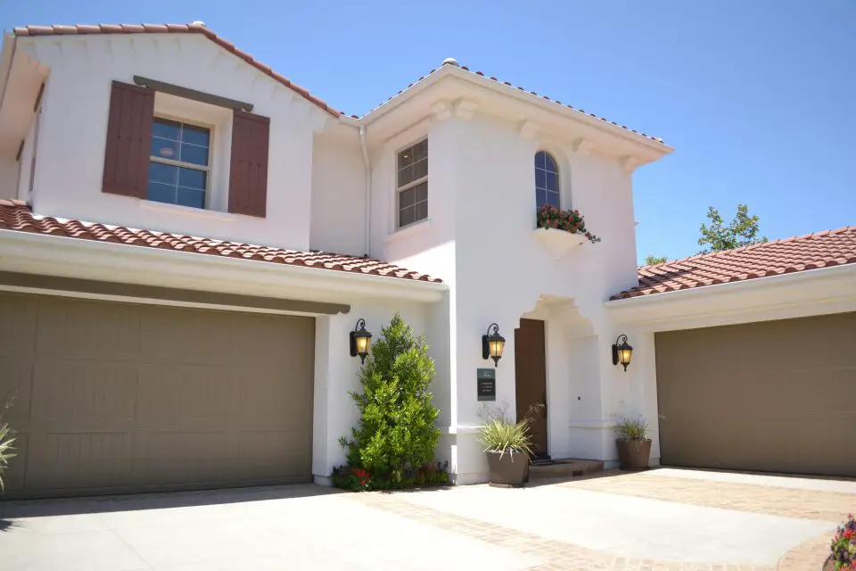 Modern house exterior with garage and plants