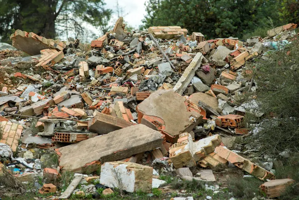 Pile of scattered bricks and construction debris.