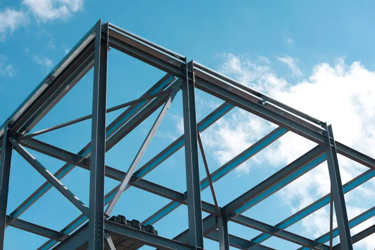 Steel building frame under blue sky