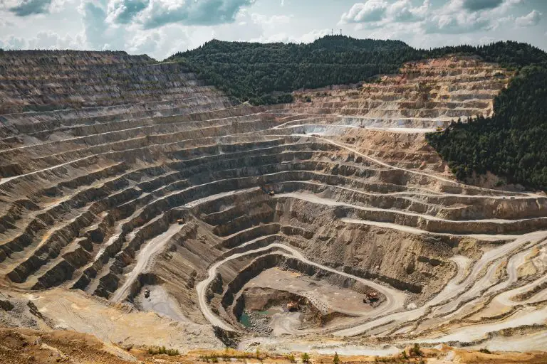 Large open-pit mine with terraced excavation levels.