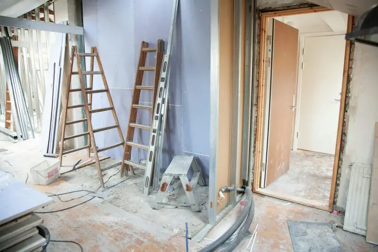 Home renovation with ladders and tools present.