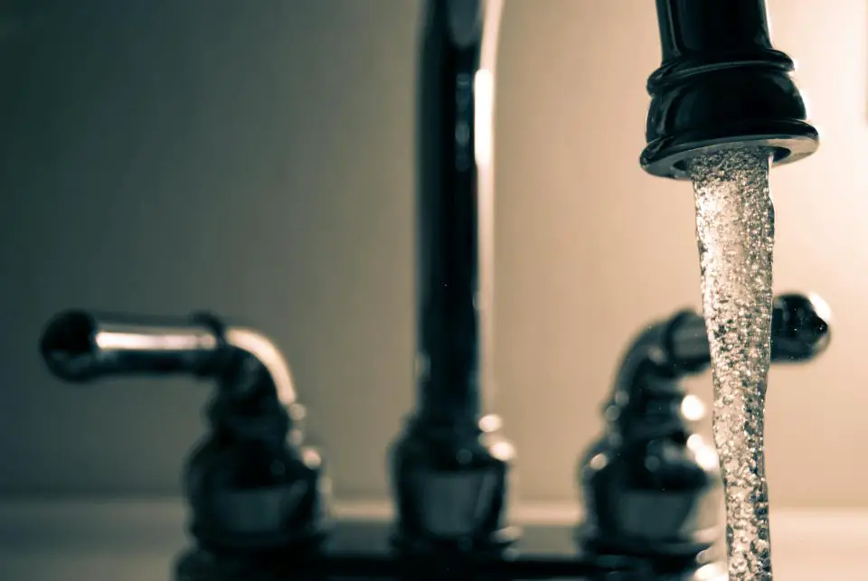 Running water from a kitchen faucet