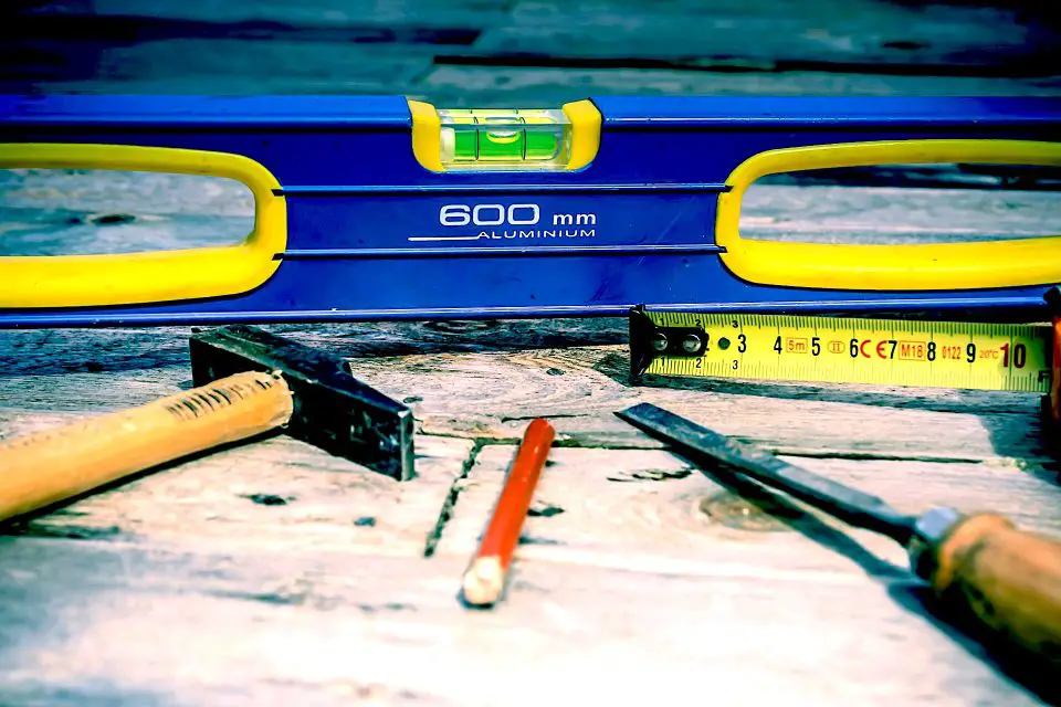 Carpentry tools on a wooden surface.