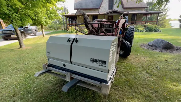 Champion generator on farming equipment near house