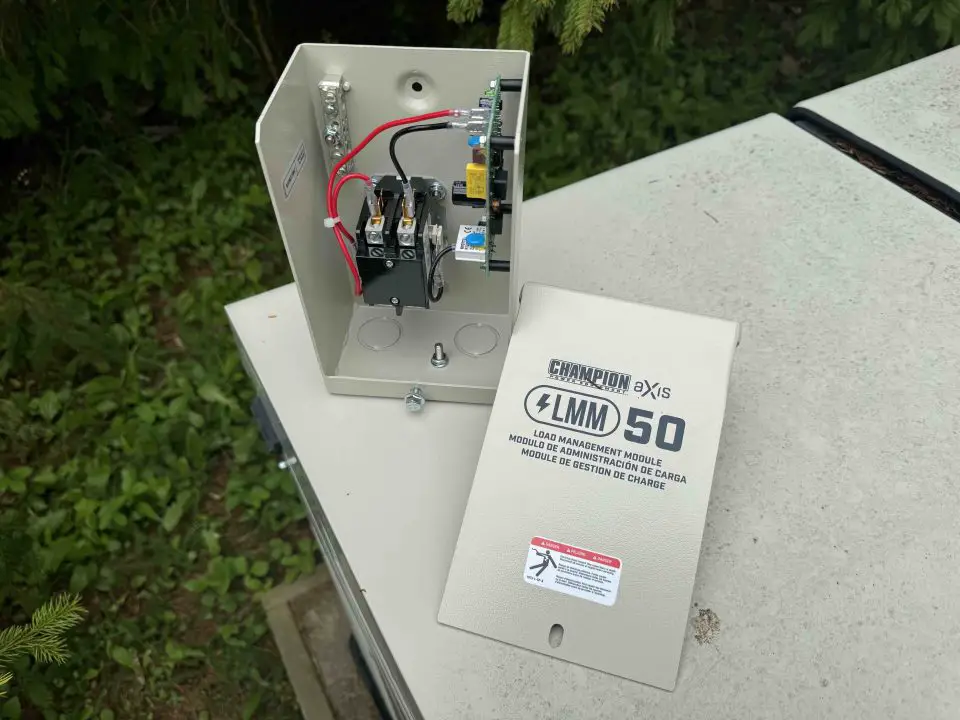 Champion Axis load management module open on table.