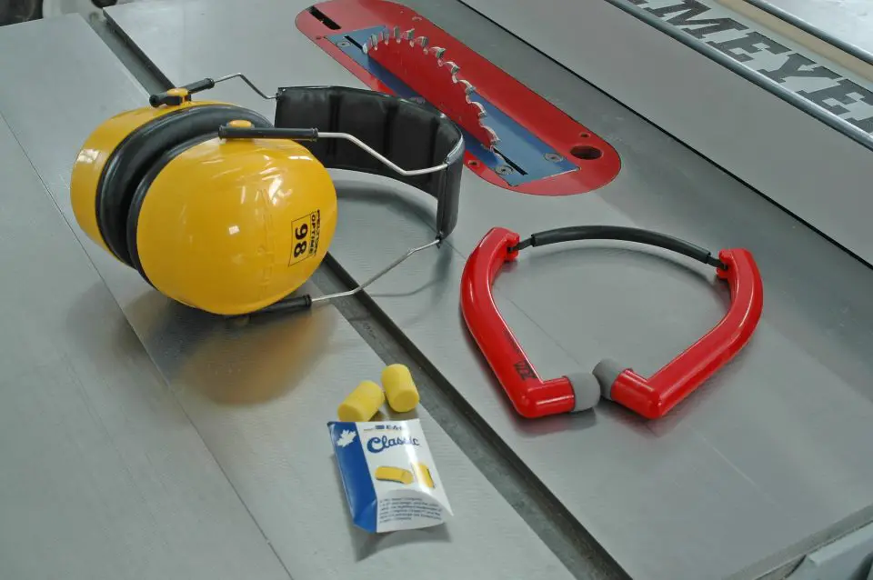 Ear protection gear on workshop table saw