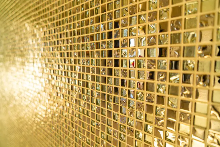 Close-up of gold reflective mosaic tiles.