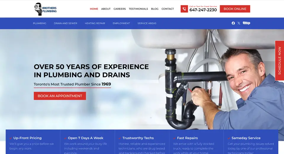Smiling plumber fixing pipes under sink, Toronto service.